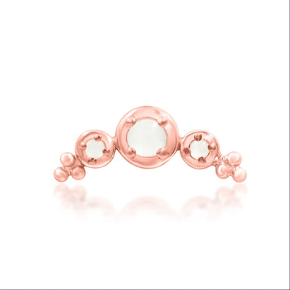 Moonstone conch jewellery in 14k rose gold, shaped in a curved arrangement designed to follow the ear.