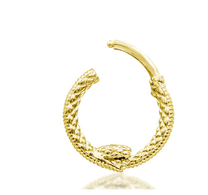 Ouroboros ring in yellow gold, shaped as a serpent consuming its tail to form a complete circle.