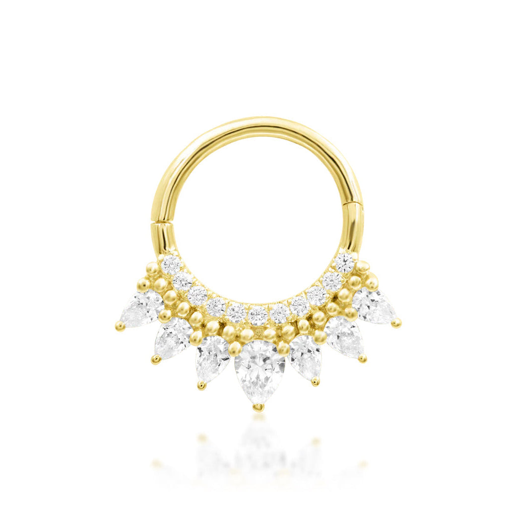 Pear CZ daith ring in 14k yellow gold featuring the crown-inspired Junipurr Magnifique design.