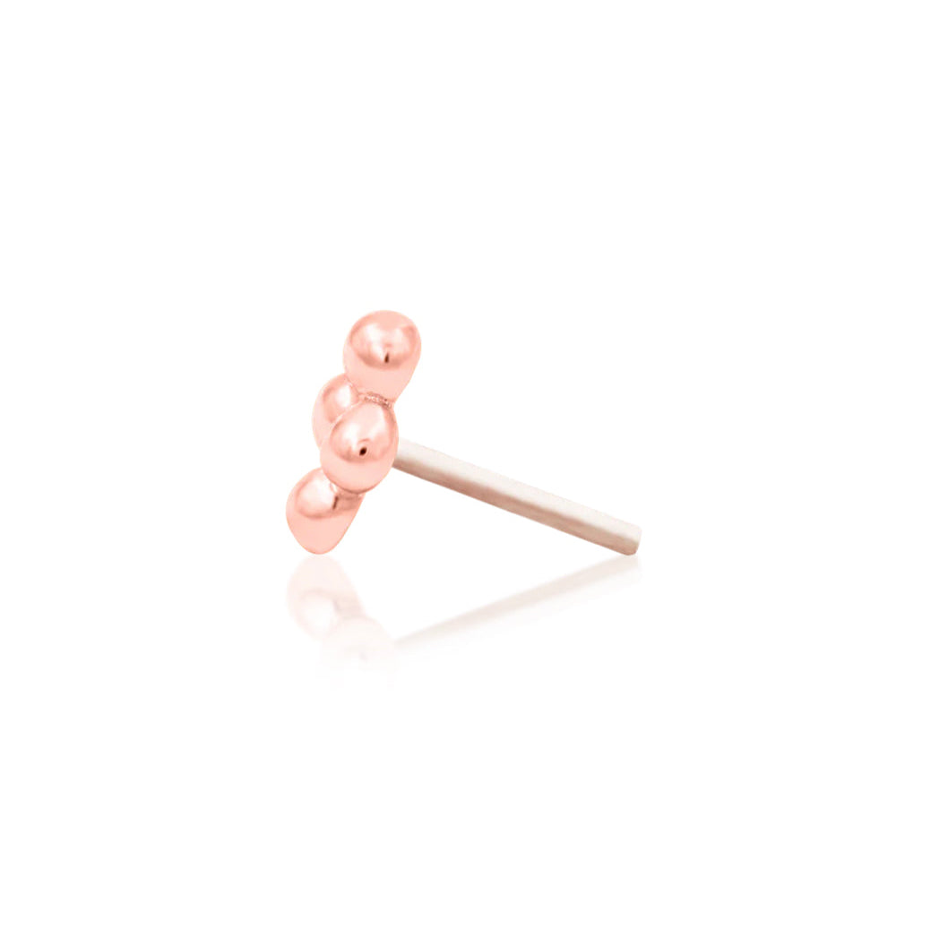 Petite gold ear-stack earring in 14k rose gold, designed to add subtle texture between larger jewellery.