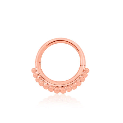 Rose gold beaded clicker ring with fourteen polished decorative beads.
