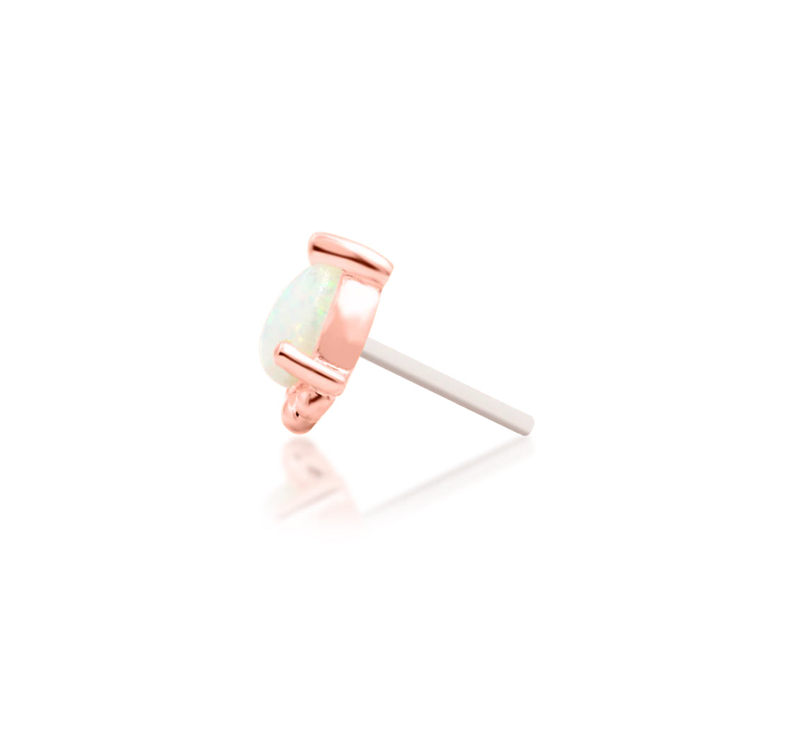 Rose gold conch earring with a petite pear-shaped opal gemstone
