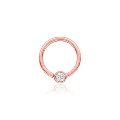 Rose gold seam ring featuring a polished fixed cubic zirconia bead.