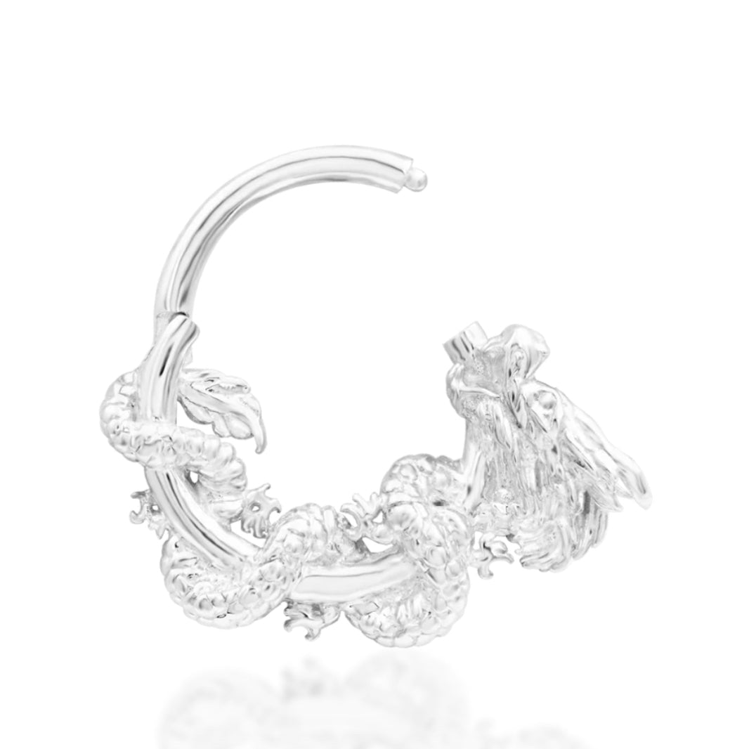 Solid gold clicker ring in 14k white gold, transformed by the detailed dragon surrounding Junipurr Azure.