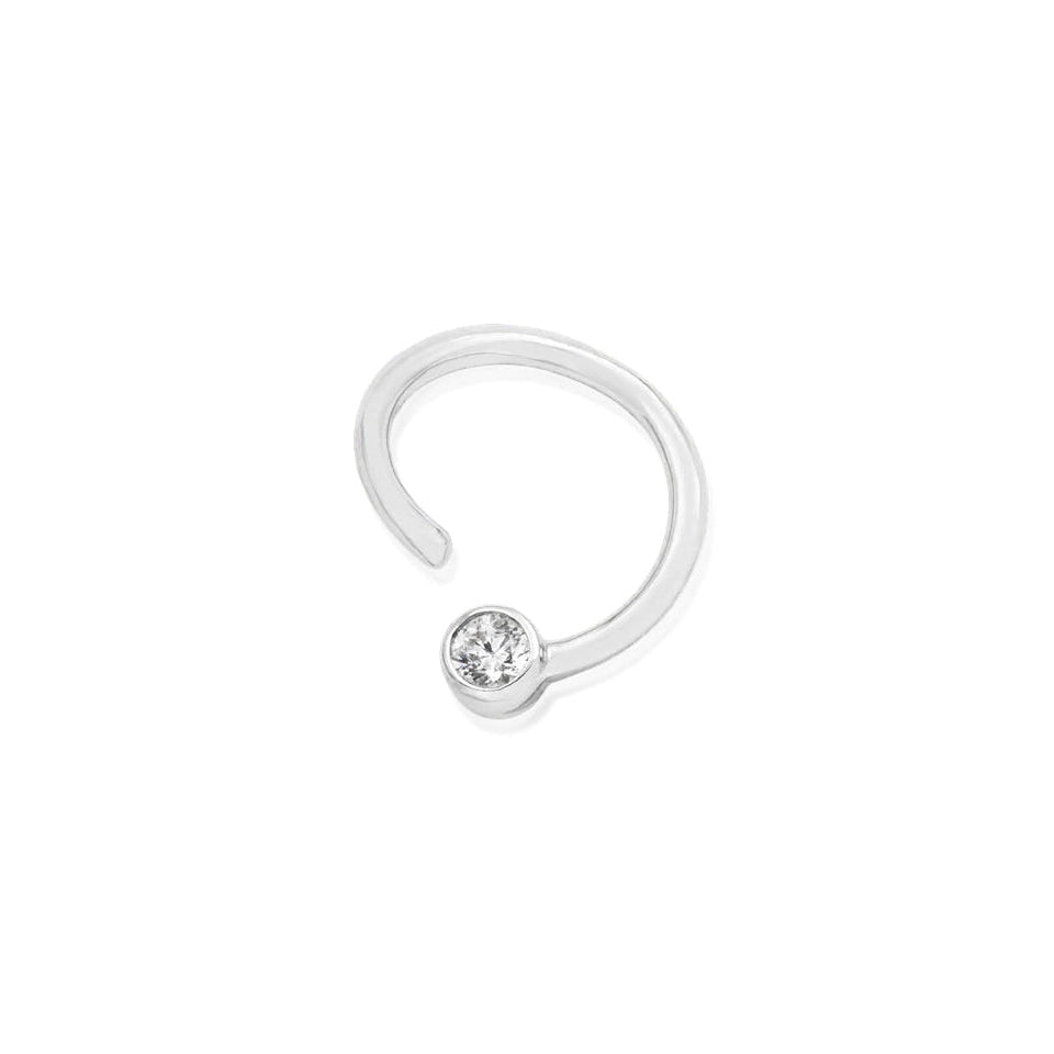 Solid gold conch ring in white gold with a permanently fixed cubic zirconia detail.