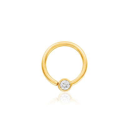 Solid gold CZ captive bead ring in 14k yellow gold featuring a fixed 3mm cubic zirconia.