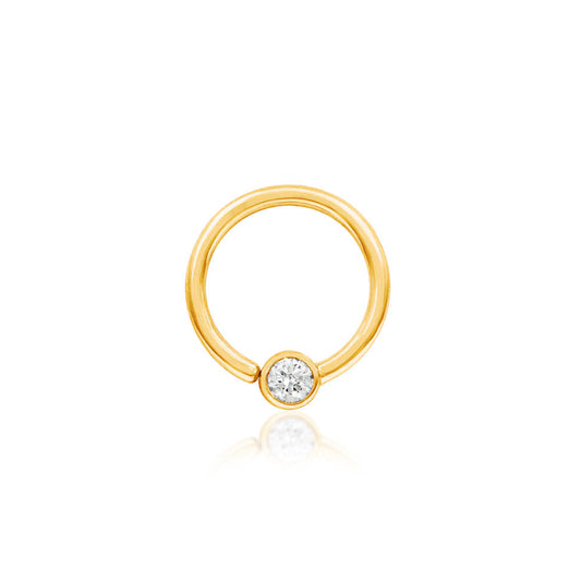 Solid gold CZ captive bead ring in 14k yellow gold featuring a fixed 3mm cubic zirconia.