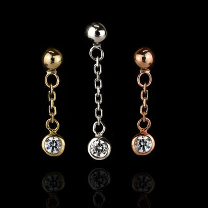 Solid gold CZ dangle earring in 14k yellow gold with a polished ball, fine chain and clear gemstone drop.