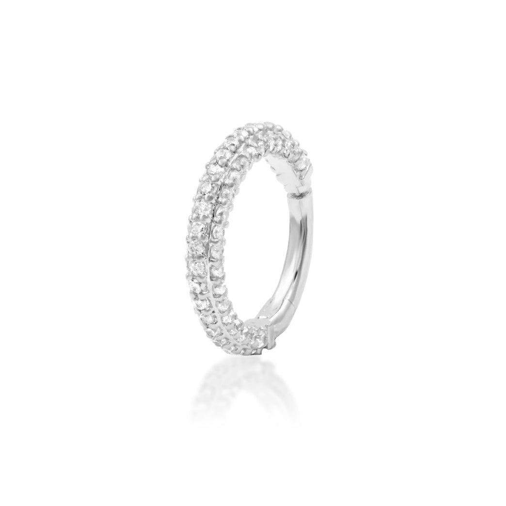 Solid gold septum ring in white gold with Demi’s continuous pavé cubic zirconia design.
