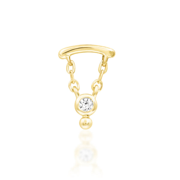 Solid gold dangle cartilage earring in 14k yellow gold with Junipurr Helena’s suspended gemstone detail.