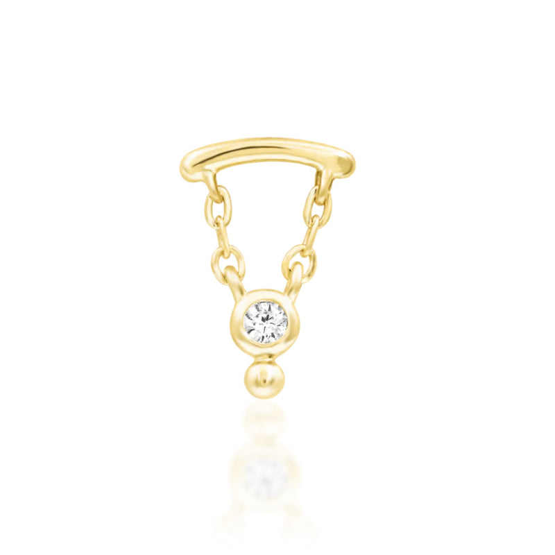 Solid gold dangle cartilage earring in 14k yellow gold with Junipurr Helena’s suspended gemstone detail.