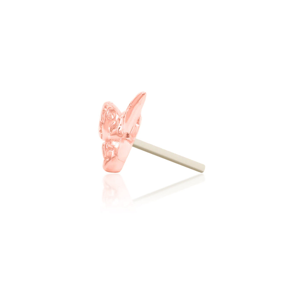     Close-up of the sculpted details on a solid 14k gold death’s-head moth earring
