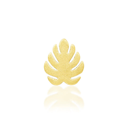 Solid gold monstera leaf cartilage earring in 14k yellow gold with a softly sandblasted matte finish.