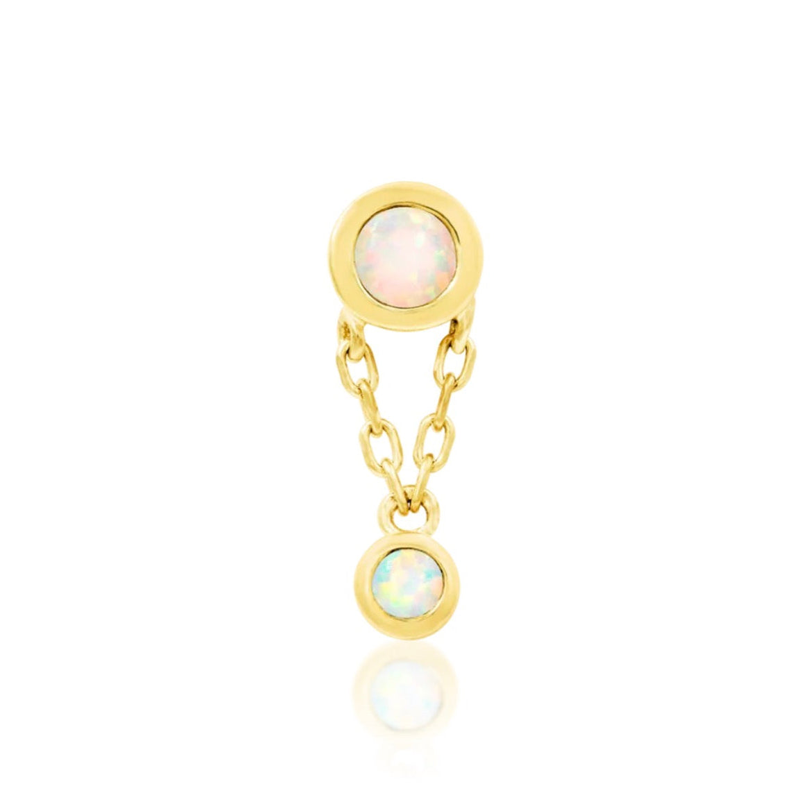 Solid gold opal dangle earring in 14k yellow gold, featuring Junipurr Clara with two bezel-set white synthetic opals and a fine chain drop.