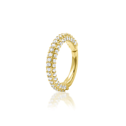 Solid gold pavé daith ring in 14k yellow gold featuring the continuous white cubic zirconia setting of Junipurr Demi.
