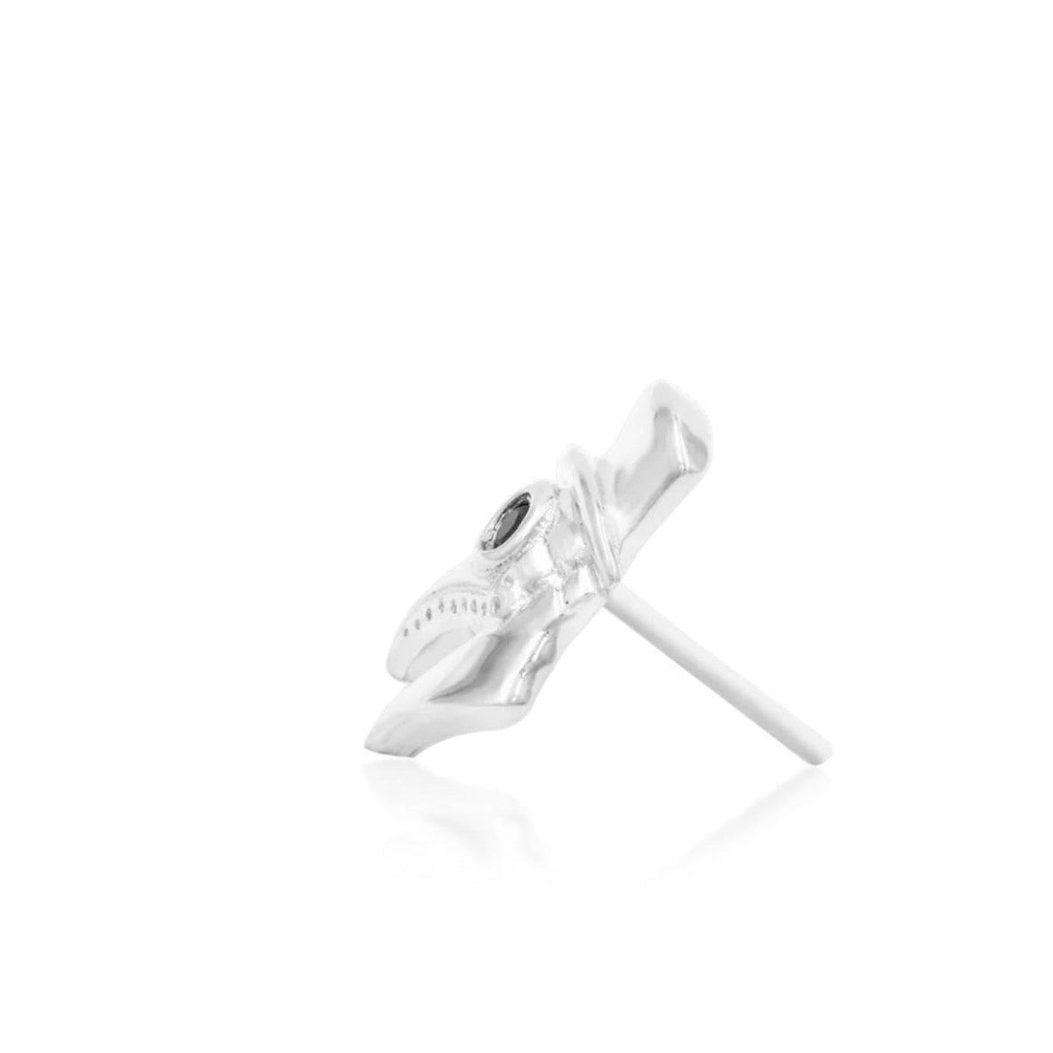 Solid white gold piercing jewellery with a sculpted mask design and black gemstone detail
