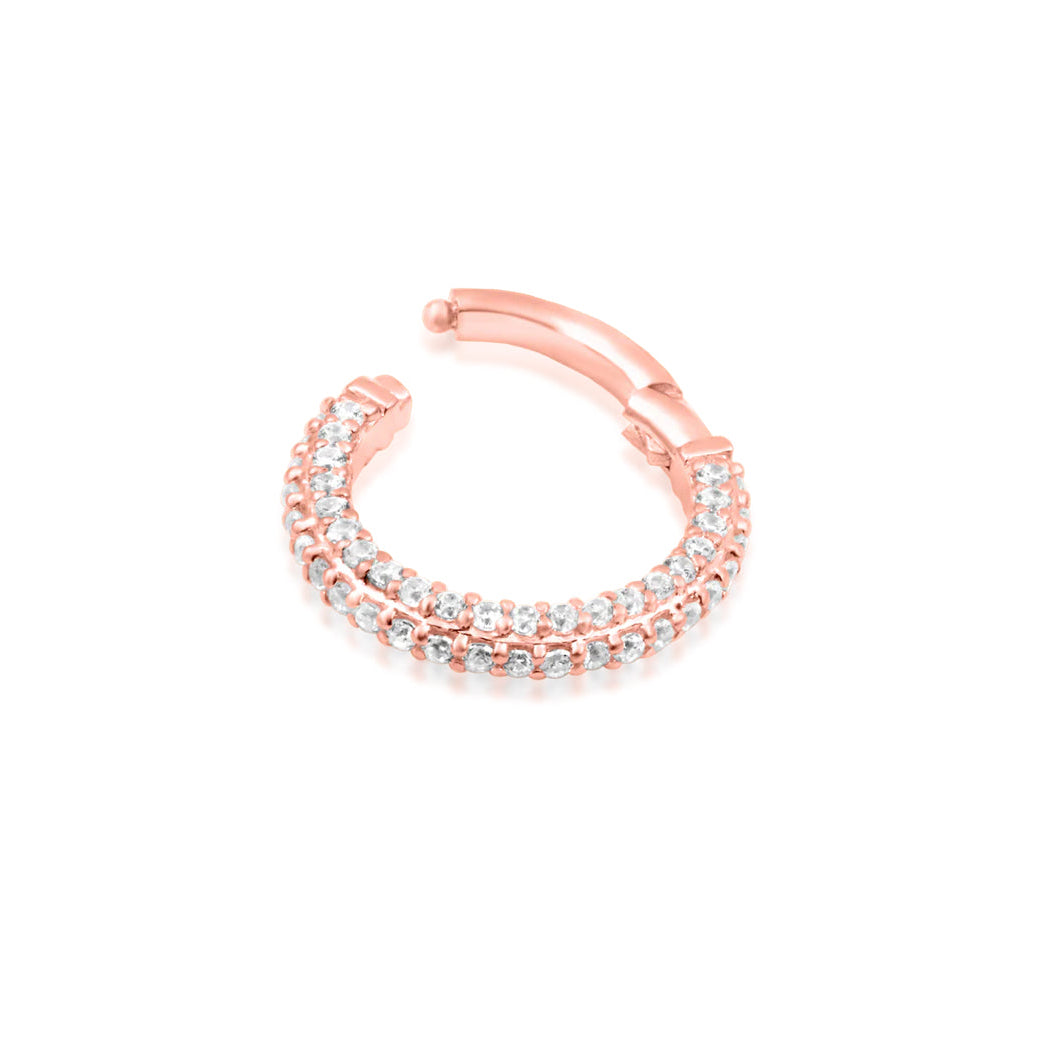 Sparkly solid gold ring in rose gold showcasing Demi’s continuous row of white cubic zirconia.
