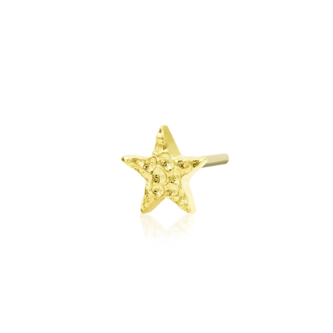 Star cartilage earring in yellow gold with a softly dimpled finish that reflects light without gemstones.
