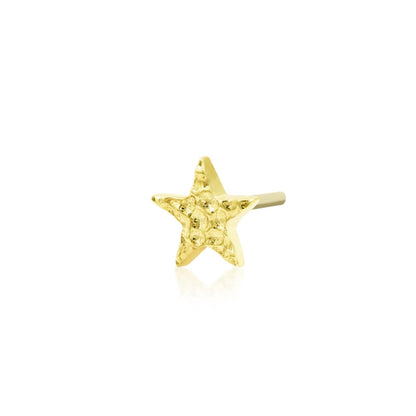 Star cartilage earring in yellow gold with a softly dimpled finish that reflects light without gemstones.