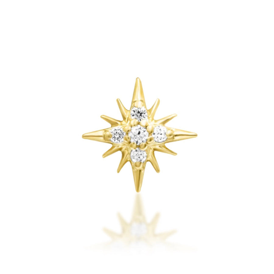 Starburst cartilage earring in solid 14k yellow gold with a central cluster of clear cubic zirconia.