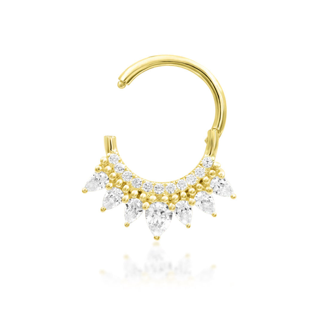 Statement clicker ring in yellow gold showcasing the dramatic pear and round white CZ arrangement of Junipurr Magnifique.