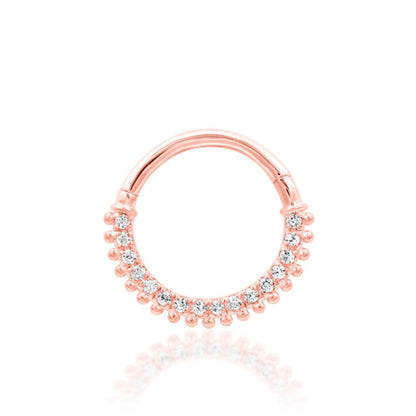 Statement septum jewellery in 14k rose gold, combining brilliant CZ sparkle with decorative gold texture.