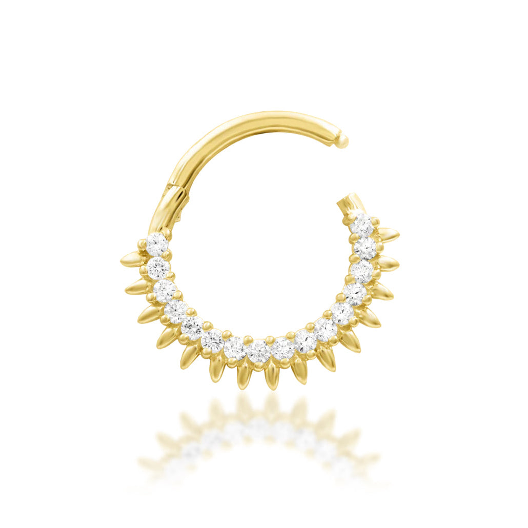 Sun ray septum ring in yellow gold, showing the radiant fan-shaped gemstone design of Junipurr Lovina.
