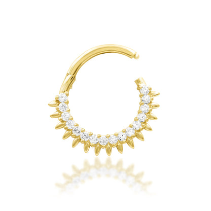 Sun ray septum ring in yellow gold, showing the radiant fan-shaped gemstone design of Junipurr Lovina.
