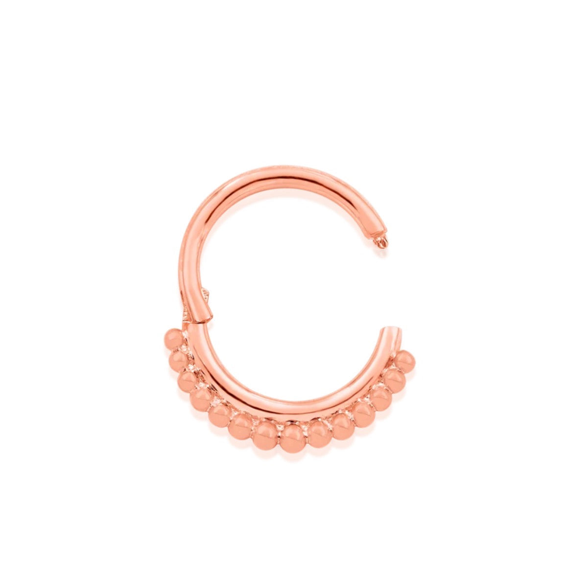Textured solid gold ring in rose gold featuring a continuous beaded profile.