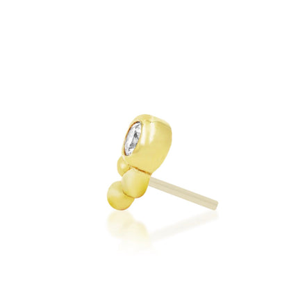 Solid yellow gold conch earring featuring a white CZ and tri-bead accent