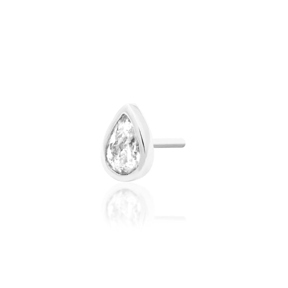 White gold cartilage jewellery featuring a bezel-set pear-shaped cubic zirconia