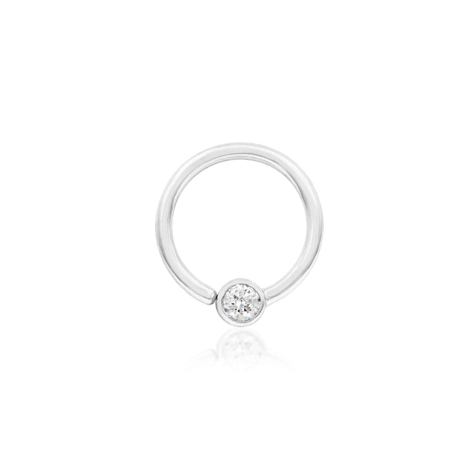 White gold septum ring featuring a polished fixed 3mm cubic zirconia.