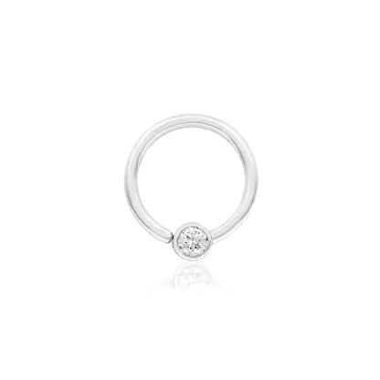 White gold septum ring featuring a polished fixed 3mm cubic zirconia.
