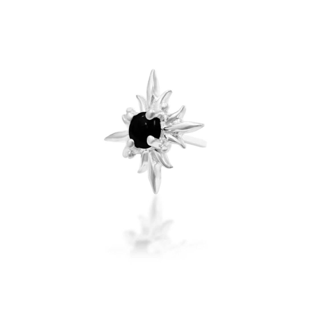 White gold flat earring with flame-like rays surrounding a polished black onyx centre
