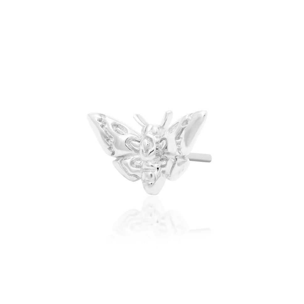     White gold gothic cartilage earring featuring a sculptural death’s-head moth design