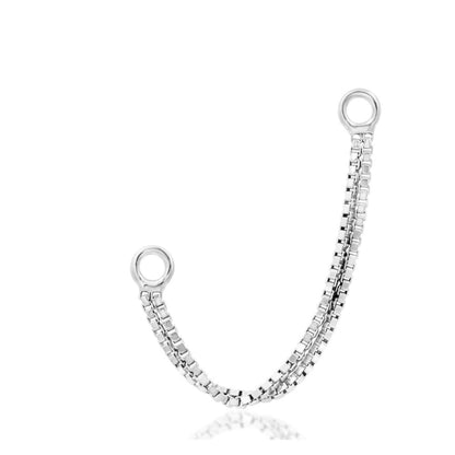 Junipurr white gold nose chain designed to connect paired nostril jewellery