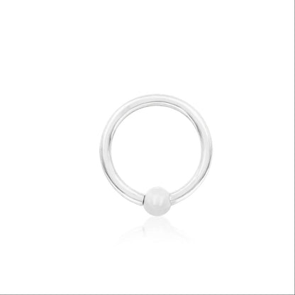 White gold nose ring with a fixed 3mm bead in Junipurr’s minimalist seam-ring design.