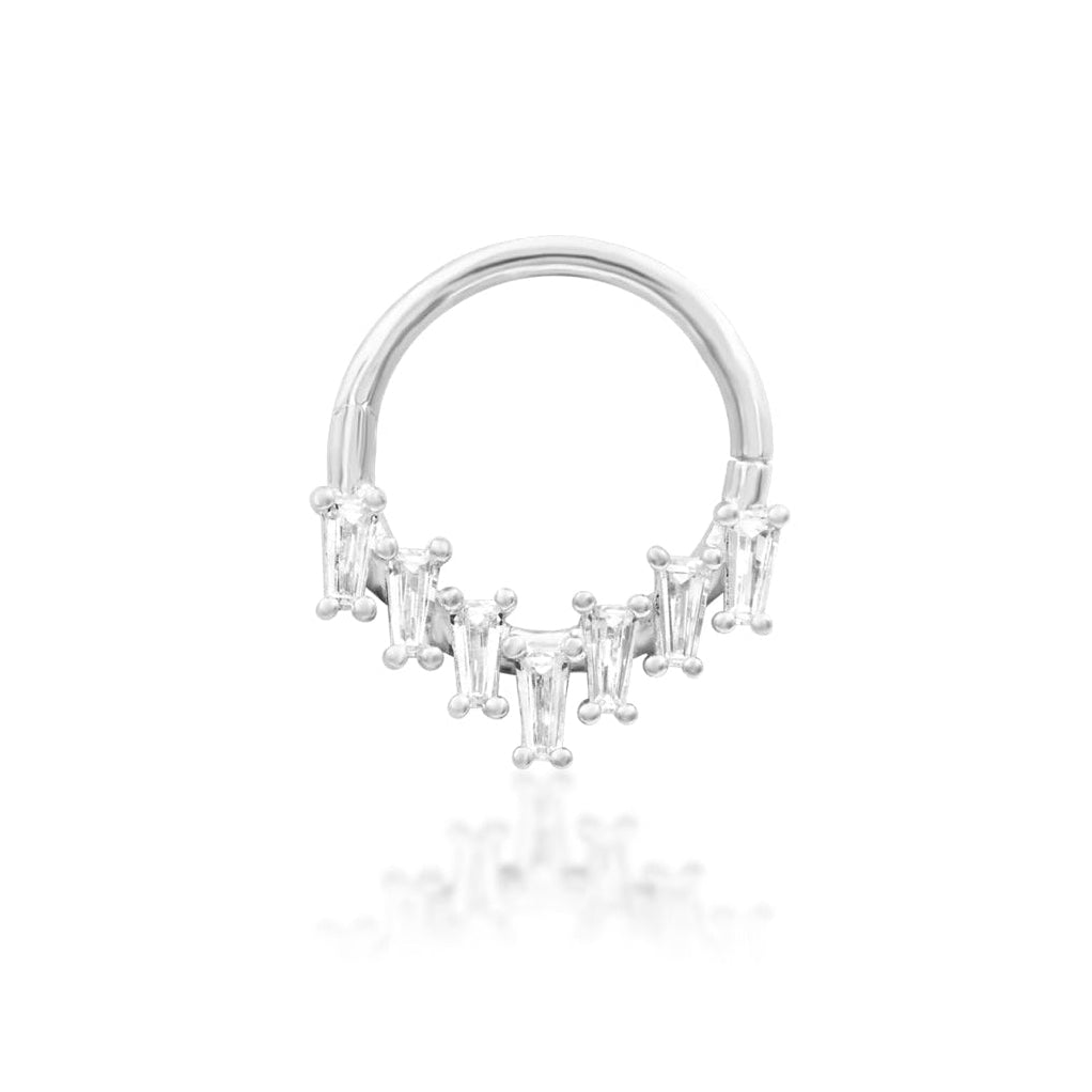 Statement piercing jewellery in 14k white gold, featuring Junipurr Corus with bold geometric crystal detail.
