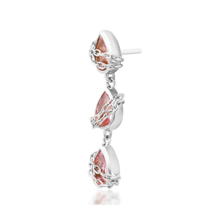     White gold conch jewellery featuring a cascading line of faceted pink cubic zirconia teardrops