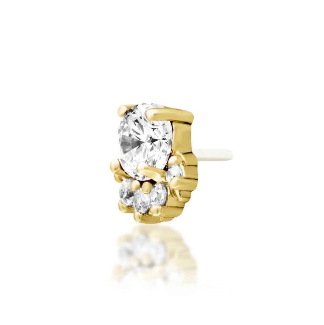 Yellow gold cartilage earring featuring a brilliant white cubic zirconia surrounded by five smaller stones