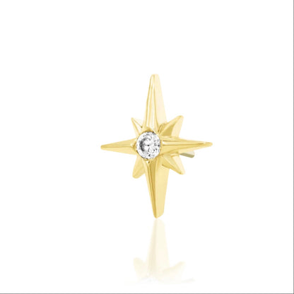Solid 14k yellow gold star piercing jewellery with a small central CZ creating concentrated sparkle.