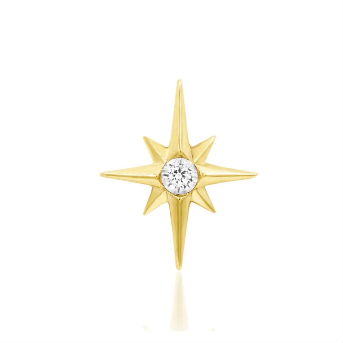Junipurr Stella in yellow gold, featuring a pointed star design with a single gemstone at its centre.