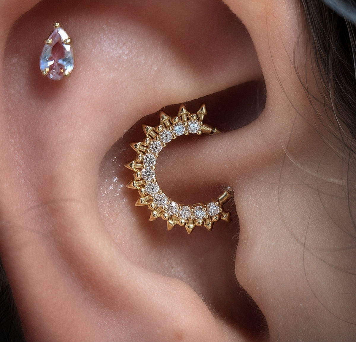 Close-up of Daith piercing with gold ring