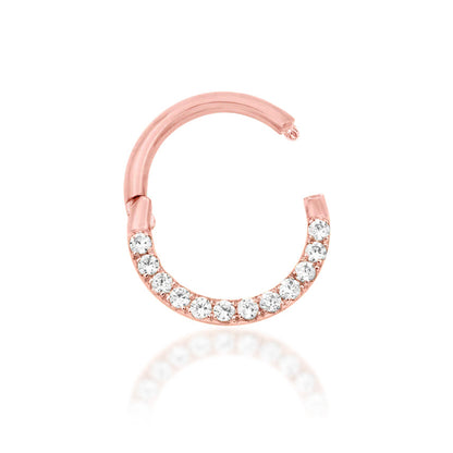 Junipurr Halo solid 14k rose gold clicker ring with 1mm White CZ stones, angled view.