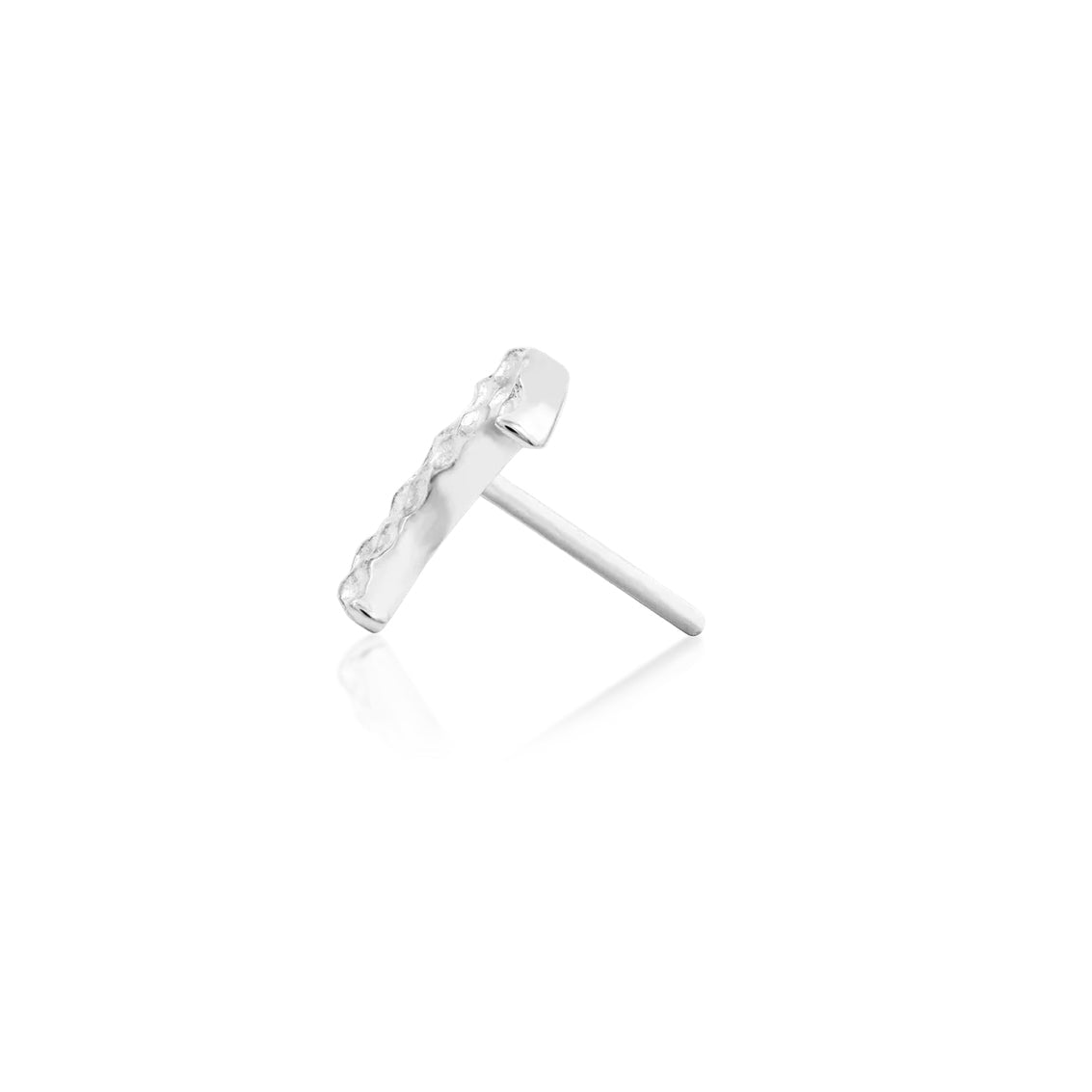 Celestial ear jewellery in solid white gold, shaped as Junipurr’s textured crescent moon.