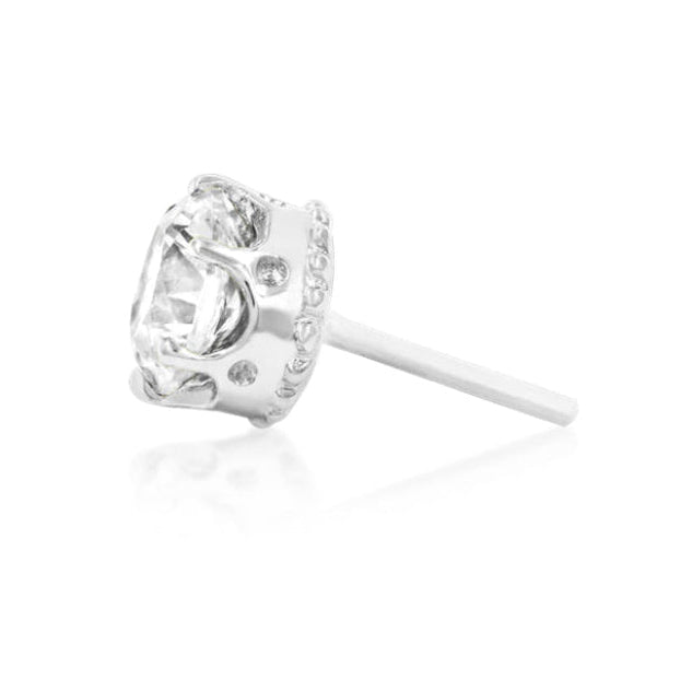 White gold flat piercing stud featuring a brilliant crown-set white CZ