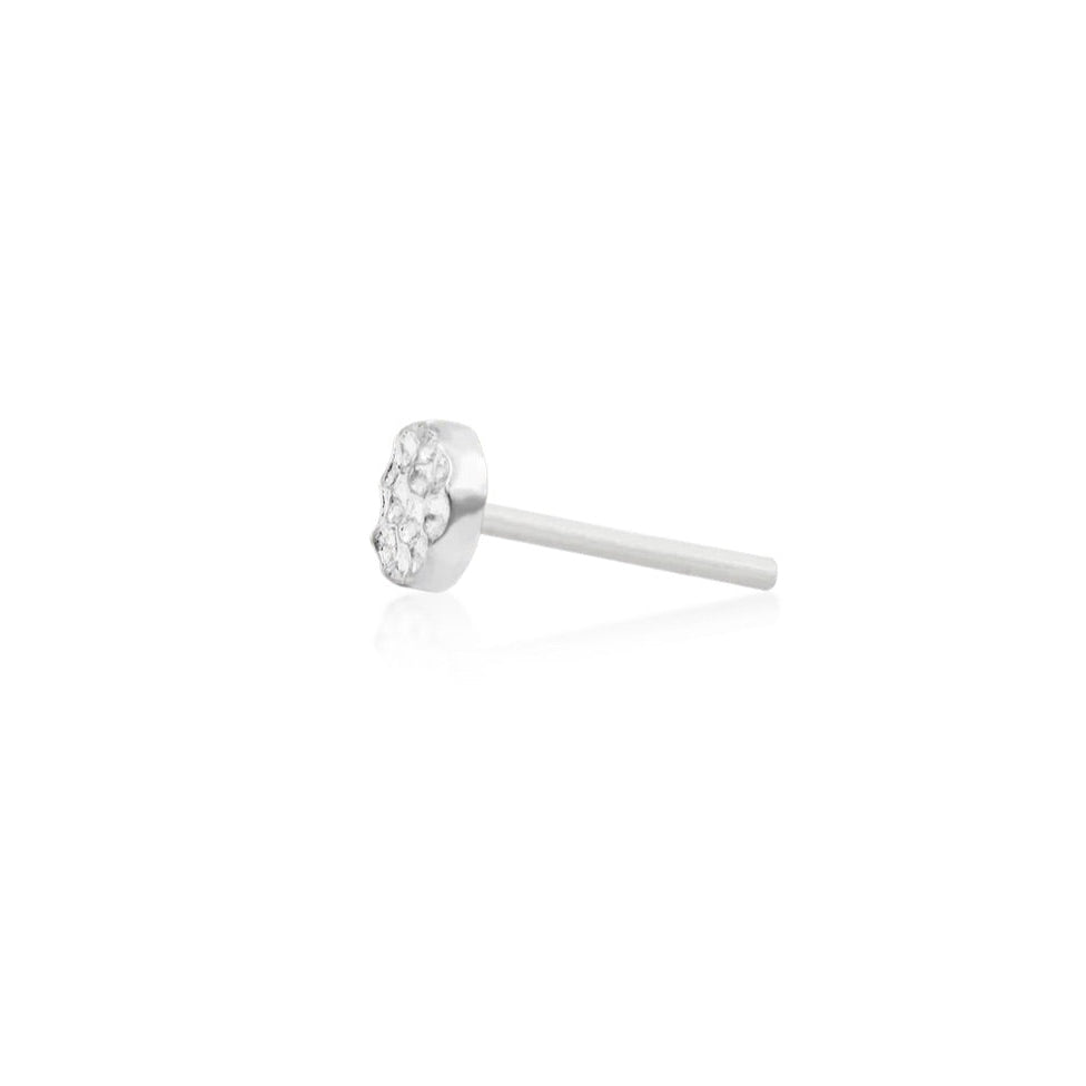 Minimal white gold flat piercing stud with a light-reflecting hammered surface
